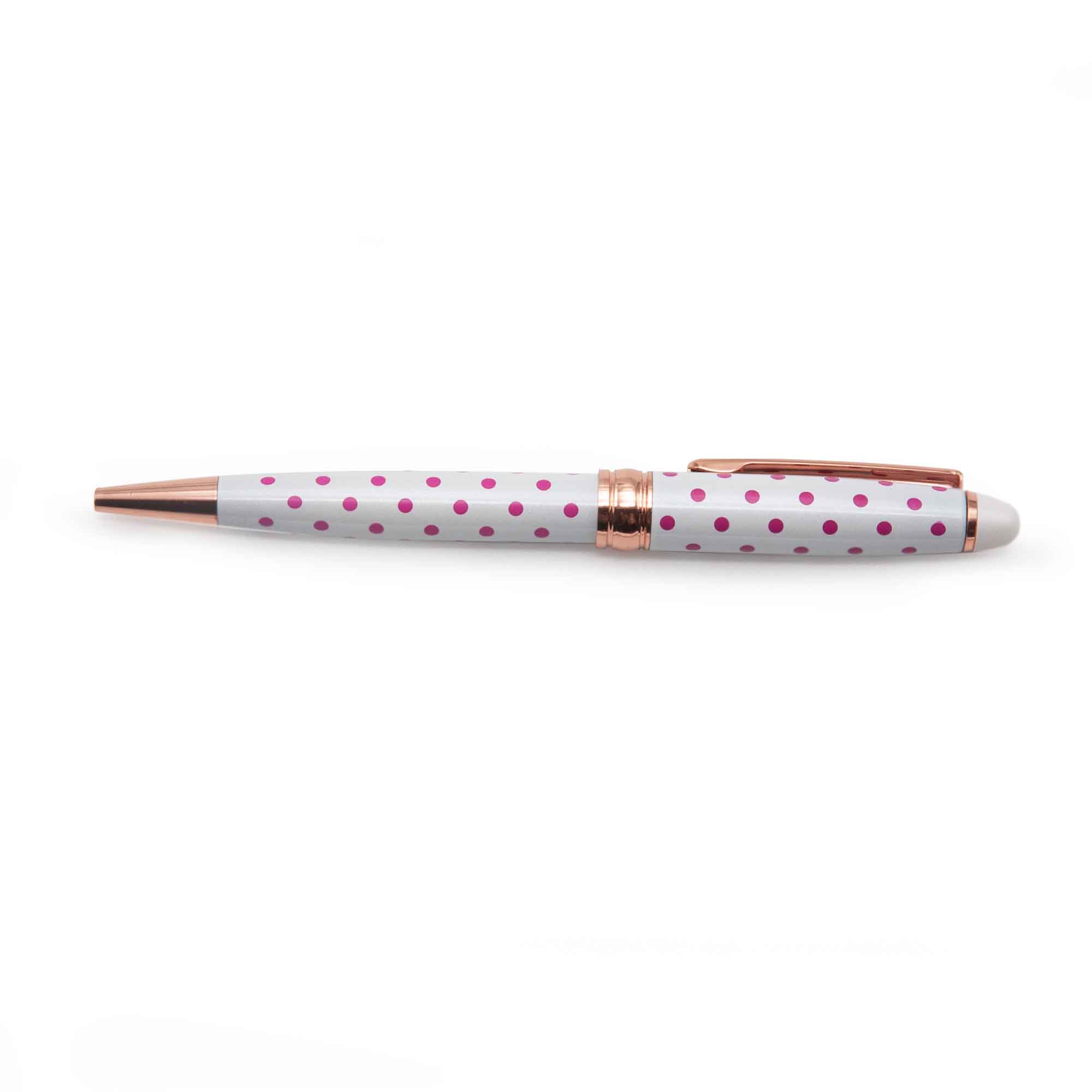 Image shows a white ballpoint pen with pink polka dots 